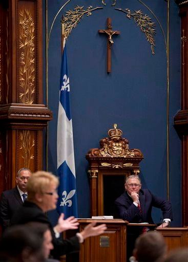 The CAQ plans to propose barring government employees from wearing religious items such as hijabs, kippas, crucifixes and turbans but indicated that it would not remove a gold crucifix displayed in Quebec’s Parliament Building.
