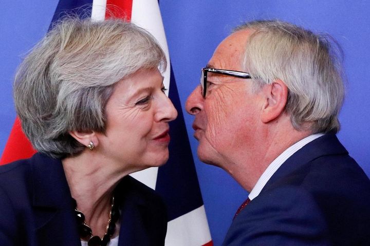 Theresa May with President of the EU Commission Jean-Claude Juncker at the summit in Brussels this week 