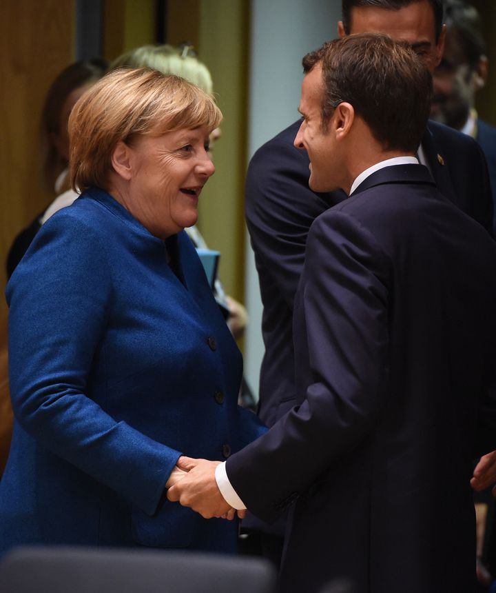 German Chancellor Angela Merkel greets France's President Macron