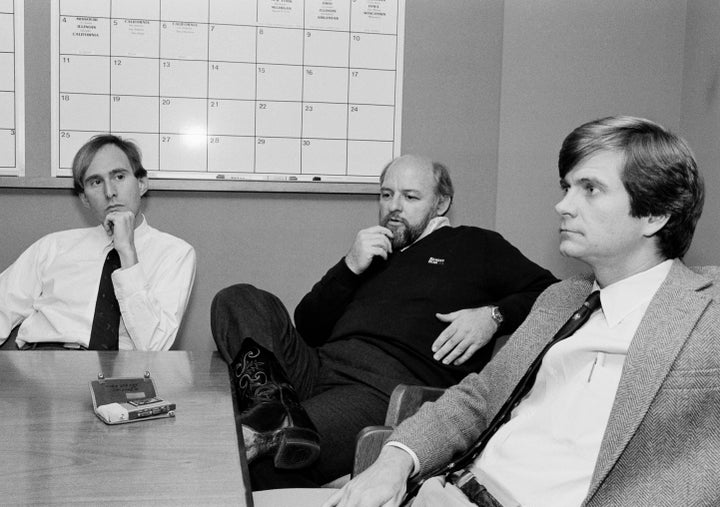 President Ronald Reagan's campaign operatives Roger Stone, left, Ed Rollins and Lee Atwater, right, discuss strategy in November 1984 after a meeting with former President Richard Nixon.