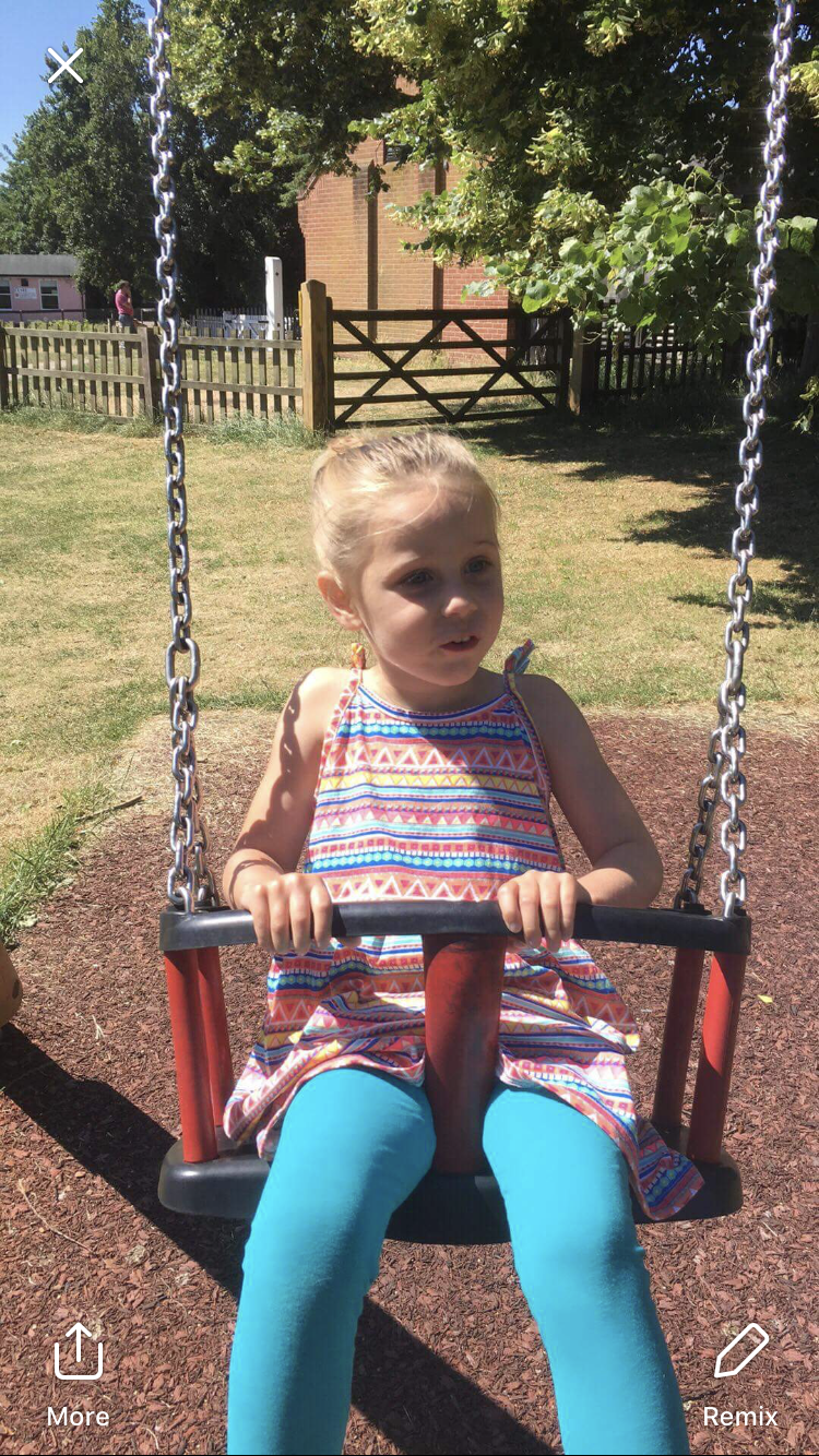 Indie-Rose Clarry on a swing