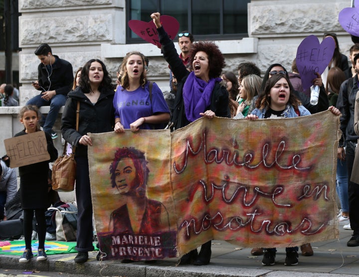 Women protest ahead of the first round of Brazil's 2018 election. 