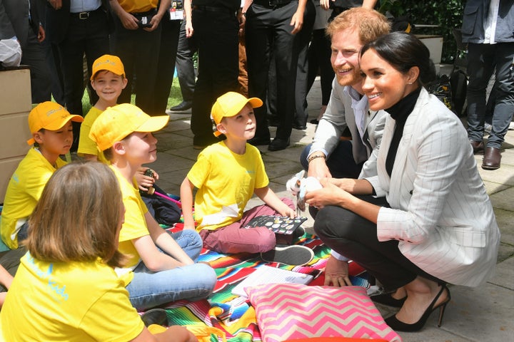 The Duke and Duchess of Sussex chat with school children in Australia.