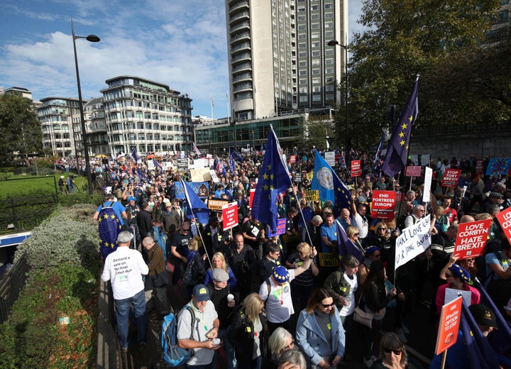 Hundreds of thousands of supporters of the European Union marched through London on Saturday to demand that the British government holds a public vote on the terms of Brexit.