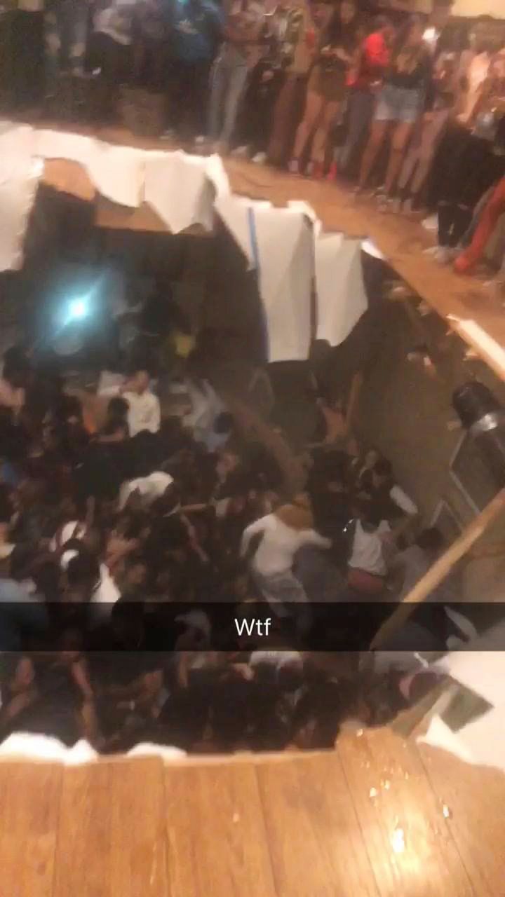 Video taken at the scene shows a pile of people lying across the basement's floor moments after the floor collapsed.