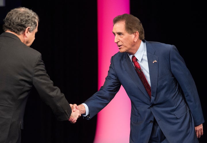 Brown (left) shakes hands with Renacci during an October debate.