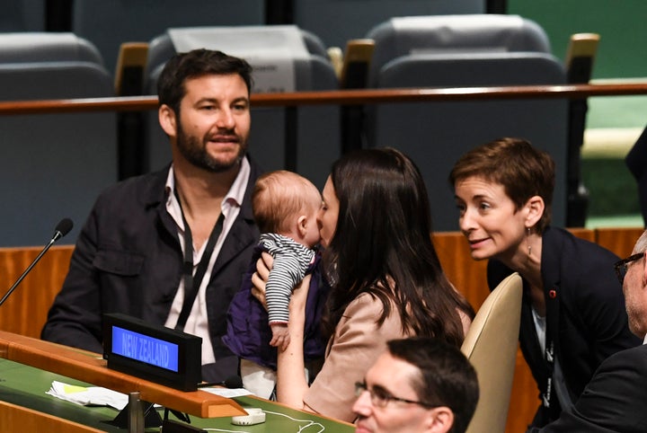 Jacinda Ardern, Prime Minister of New Zealand, kisses her daughter Neve Te Aroha Ardern Gayford, as her partner Clarke Gayford looks on during the Nelson Mandela Peace Summit September 24, 2018, at the United Nations in New York. 