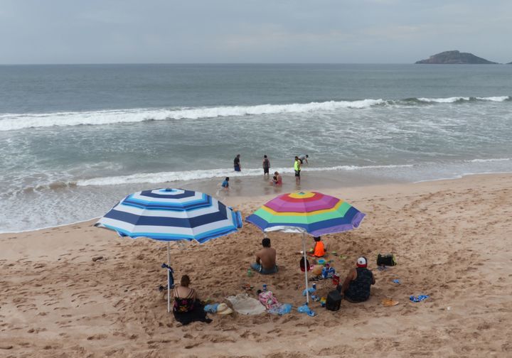 Tourists enjoy the beach in Mazatlan, Sinaloa state, Mexico on Oct. 21, where Hurricane Willa is expected to land Oct. 23.