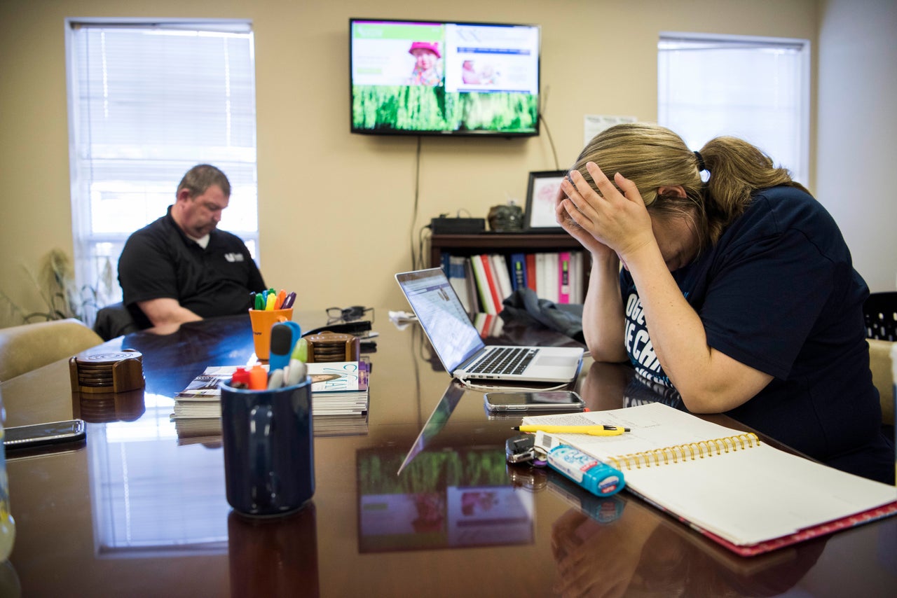 Amber runs through logistics on a conference call with United MSD Foundation board members as Willow's dad, Tom Cannan, sits by.