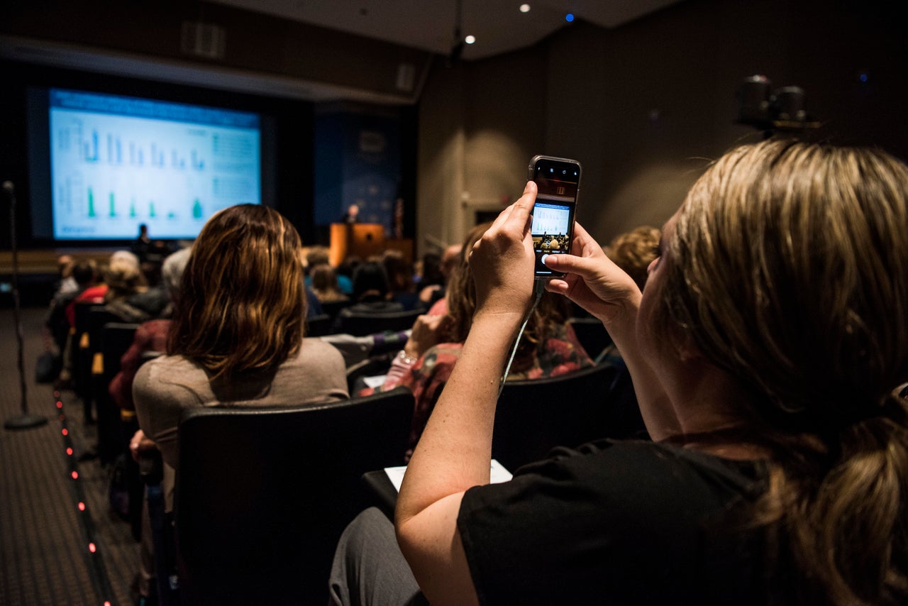 Amber takes a picture during Rare Disease Week at the National Institutes of Health in Bethesda, Maryland. She says following all the science and meeting with other parents is exhausting.