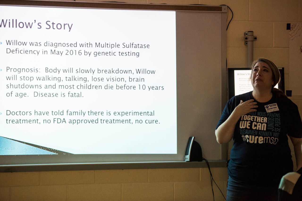 Amber cries as she speaks about Willow's decline before a roomful of students at Ocean Springs High School, where Kylee is a student.