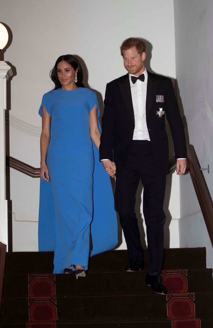 Prince Harry and Meghan, the Duchess of Sussex, arrive for a reception and state dinner at the Grand Pacific Hotel in Suva, Fiji, on Oct. 23.