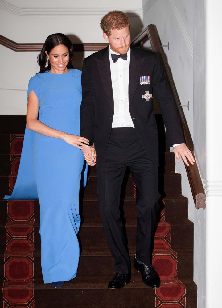 Meghan appeared to be wearing dark blue heels with her outfit. 