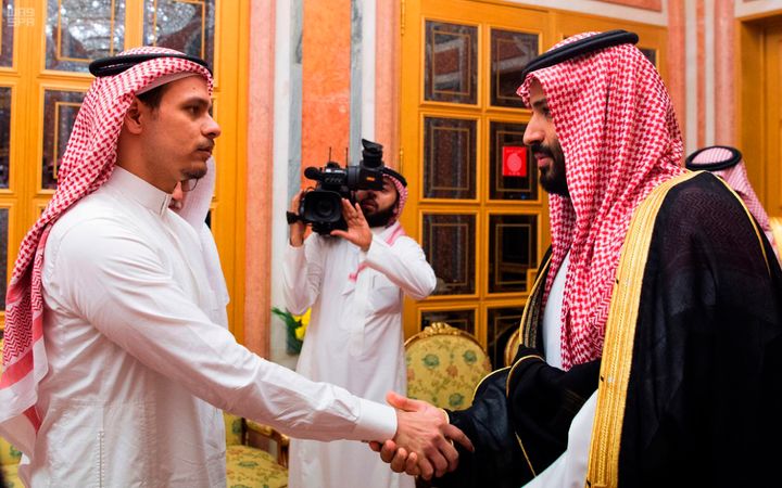 Saudi Crown Prince Mohammed bin Salman (right) shakes hands with Salah Khashoggi, son of Jamal Khashoggi, in Riyadh on Oct. 23, 2018.