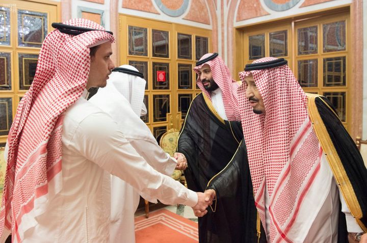 Saudi King Salman and crown prince bin Salman shaking hands with members of Khashoggi's family including his son 