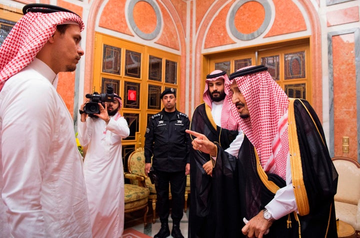 King Salam (right) speaks to Salah Khashoggi during the photo op.