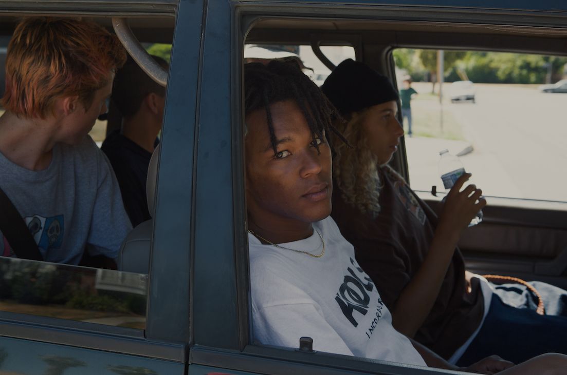 Na-kel Smith, who plays Ray, stares out from a car during the making of "Mid90s."