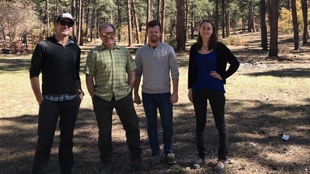 Anthony Culpepper, Aaron Kimple, Matt Cook and Laurel Sebastian — all of the Mountain Studies Institute — stand in a clearing atop Reservoir Hill in Pagosa Springs. The city-owned forest was thinned with the support of the local forest health collaborative.