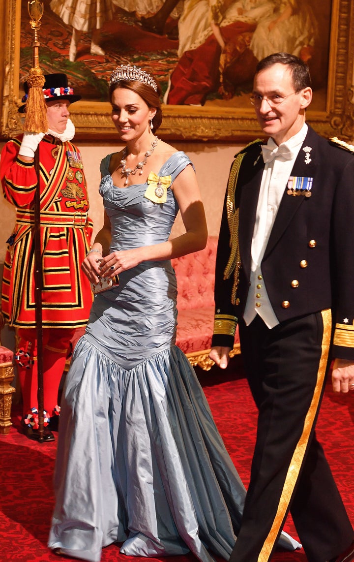 Kate walks with Rear Adm. Ludger Brummelaar at a state banquet in honor of King Willem-Alexander and Queen Maxima of the Netherlands at Buckingham Palace on Oct. 23, 2018.