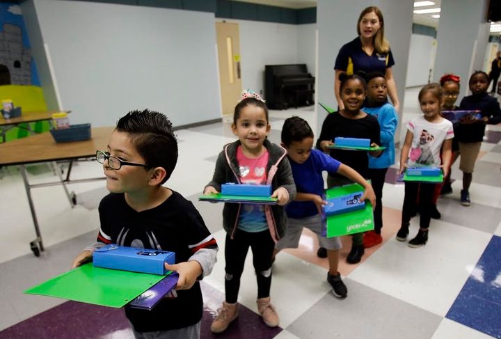 Scientists expect a growing number of hurricanes to strike the US with climate change - and Hurricane Maria sent these school children and their parents from Puerto Rico to Florida. 