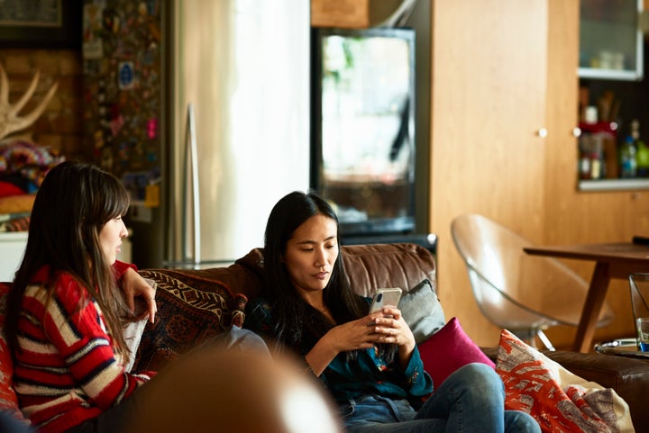 Burying your nose in your phone is <em>one</em> way to deal with prying questions about your choice to stay child-free.