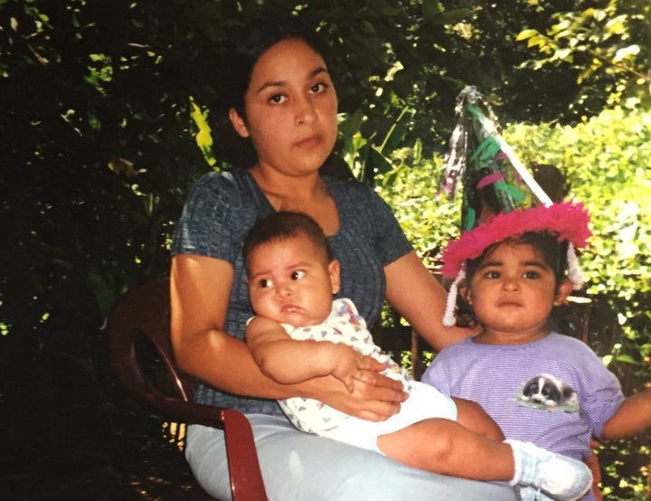 Idalia Majano-Amaya, now a TPS recipient, sits with her two eldest children, Sam and Diana Amaya, in El Salvador in the early
