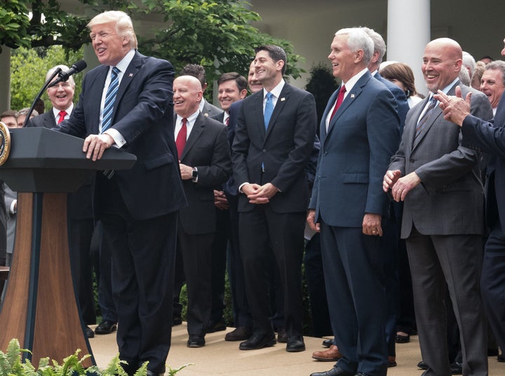 MacArthur, at far right, at a White House press conference following the House passage of the health care bill.