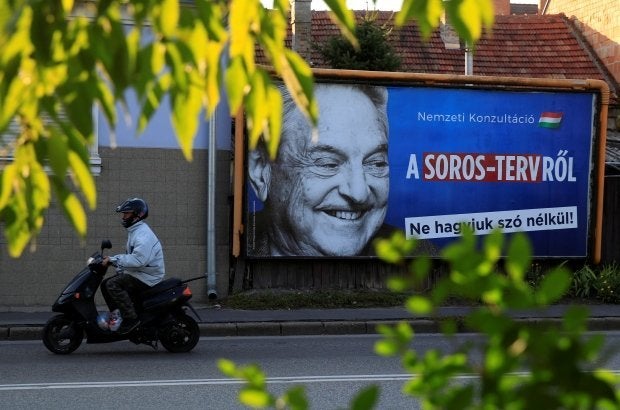 The anti-Soros posters in Hungary present him as a foreign enemy to undermine the government.