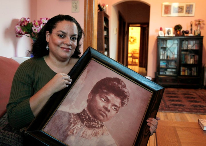 Michelle Duster with a photo of her great-grandmother, Ida B. Wells.