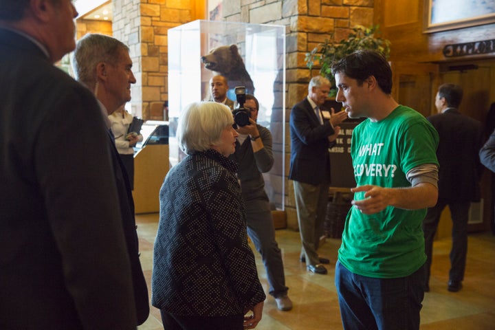 Ady Barkan speaks to Federal Reserve Chairwoman Janet Yellen during the inaugural Fed Up protest in Jackson Hole, Wyoming, on Aug. 23, 2014.