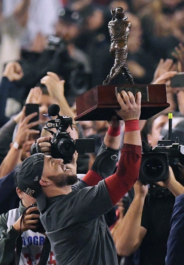 Boston Red Sox's Steve Pearce holds the MVP trophy after Game 5 of baseball's World Series against the Los Angeles Dodgers on