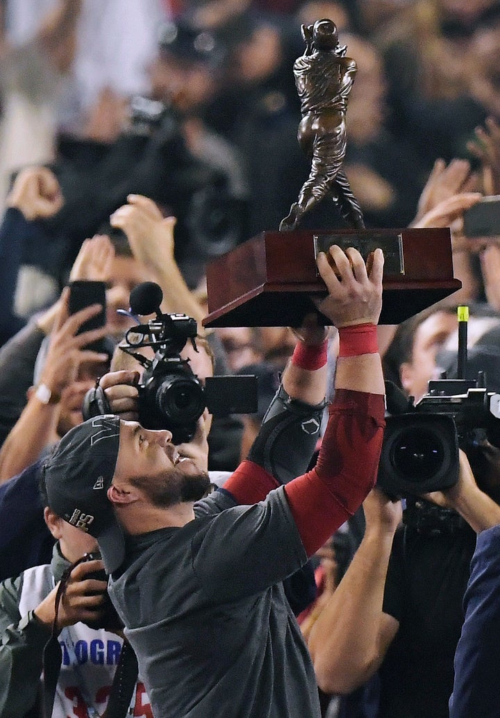 Boston Red Sox's Steve Pearce holds the MVP trophy after Game 5 of baseball's World Series against the Los Angeles Dodgers on Sunday.