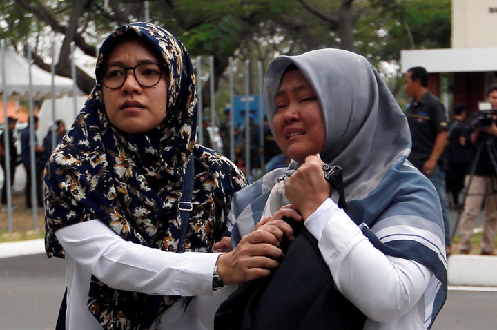 Relatives of passengers arrive at a crisis center located at Soekarno Hatta International airport near Jakarta