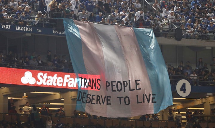 A banner with the words ‘Trans People Deserve to Live’ is displayed during Game Five of the 2018 World Series bet