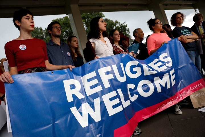 Activists hold a banner during a demonstration organized by HIAS outside the U.S. Capitol on Sept. 14, 2017.