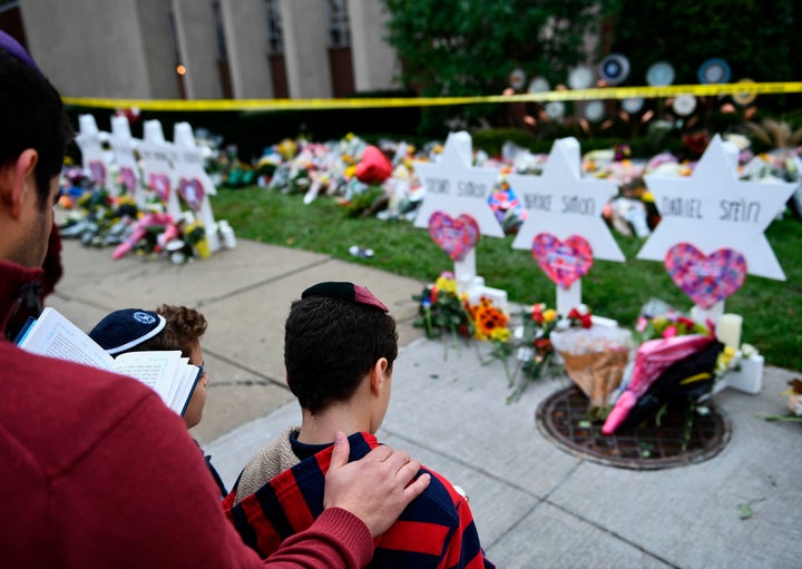 People pay their respects at a memorial outside the Tree of Life synagogue in Pittsburgh on Oct. 29, 2018.