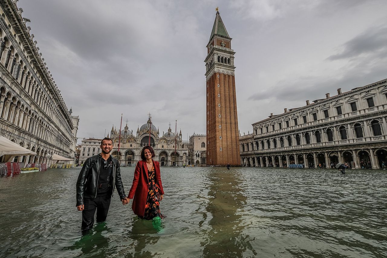  A couple wading in Piazza San Marco.