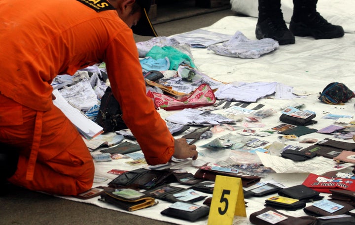 Divers recovered debris from the crash site on Tuesday. They're still searching for the plane's data recorders.