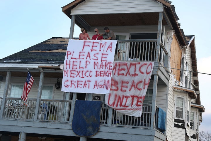 Residents hang a sign out that reads, 'FEMA Please Help Make Mexico Beach Great Again' outside their home that was damaged by Hurricane Michael. The town of Mexico Beach was particularly hard hit.