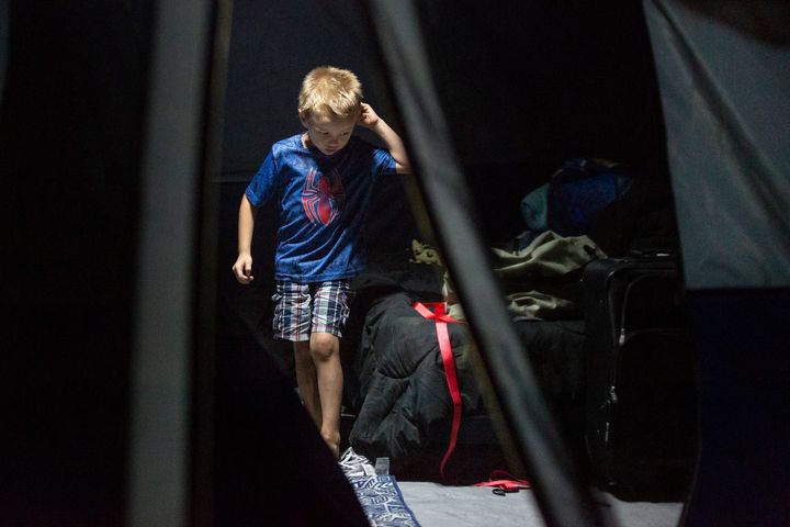 Christopher Schaefer, 4, walks through the tent he and his family began living in after Hurricane Michael devastated the Florida Panhandle in mid-October.