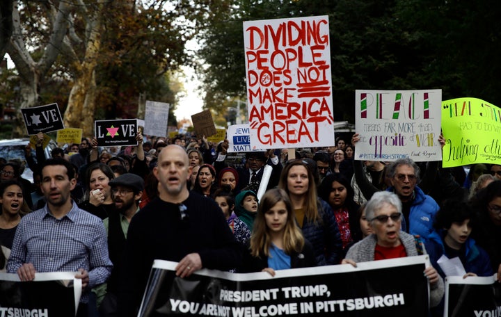 Protesters gathered as President Donald Trump and first lady Melania Trump visited the memorials of the Tree of Life shooting victims.