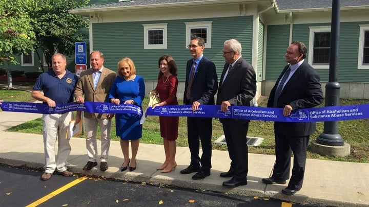 <p>New York state officials, including the drug and alcohol commissioner, Arlene González-Sánchez (middle), and Lt. Gov. Kathy Hochul (third from left), attend a ribbon-cutting ceremony in Batavia, New York, for the opening of a new methadone clinic. New York is among a handful of states that are urging opioid treatment providers to set up new clinics in underserved areas. </p>