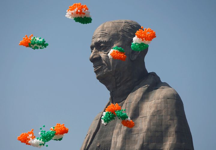 Balloons fly around the face of Sardar Vallabhbhai Patel's statue as it is formally dedicated.