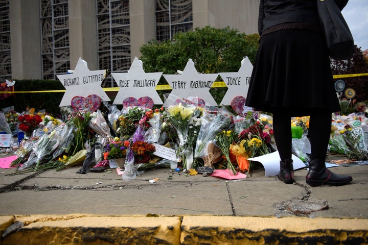 Mourners visit the memorial outside the Tree of Life Synagogue on Oct. 31, 2018 in Pittsburgh, Pennsylvania.