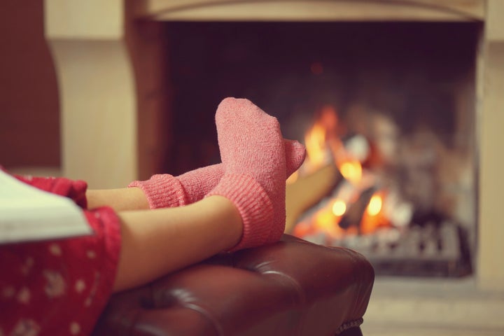 Enjoying Warm Tea In Cozy Sock On A Cold Autumn Day Stock Photo