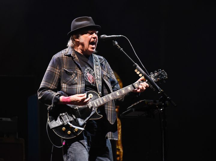 Rock icon Neil Young is calling out Spotify for distributing the misinformation-filled podcast by conspiracy theorist Joe Rogan. 