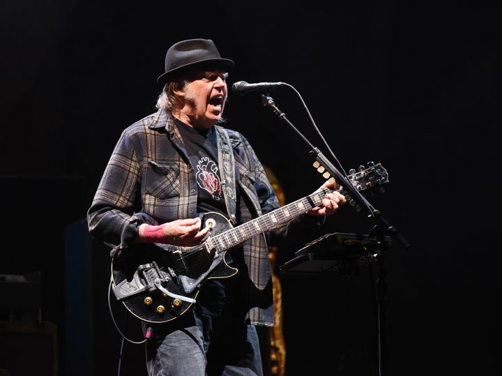 Rock icon Neil Young is calling out Spotify for distributing the misinformation-filled podcast by conspiracy theorist Joe Rogan.