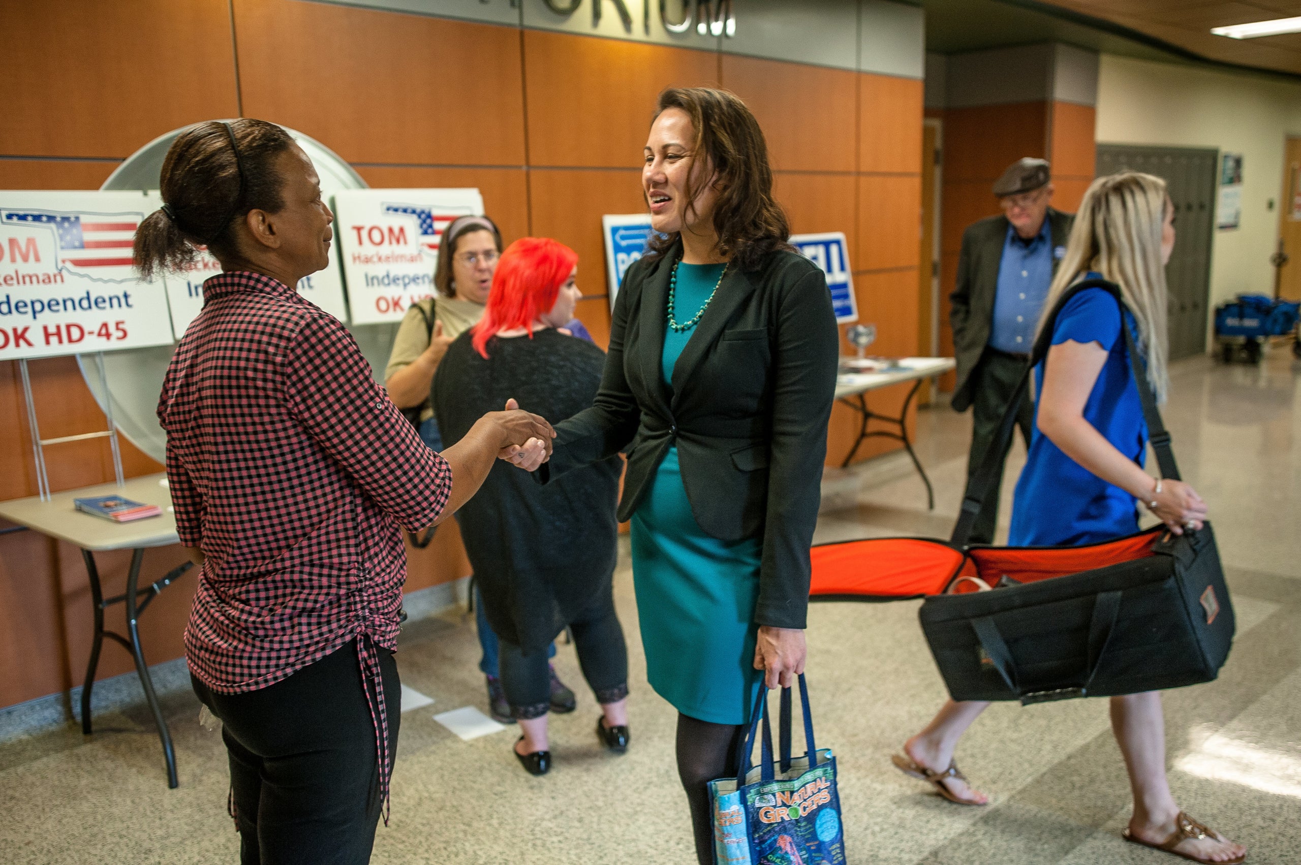 McCray talks to a constituent at a candidate forum in Oklahoma City.