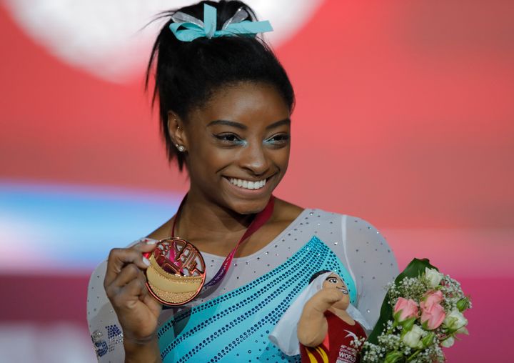 Simone Biles captured her fourth all-around title at the World Gymnastics Championships in Doha, Qatar, on Thursday.
