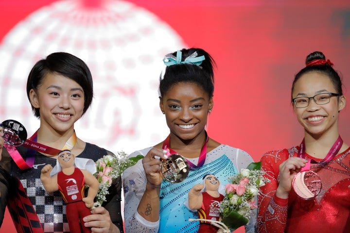 Japan’s Mai Murakami (left) came in second place in the all-around competition with 55.798 points, Biles came in first with 57.491 points and Biles’ teammate Morgan Hurd came in third with 55.732 points.